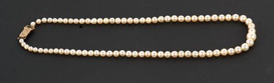 Lot 122 - A cultured pearl necklace, the graduated...