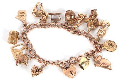 Lot 198 - A 9ct charm bracelet, the curblink chain with...