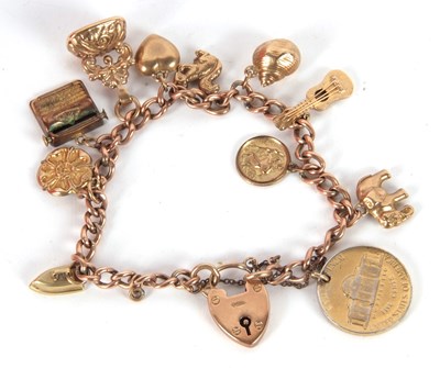 Lot 160 - A 9ct charm bracelet, with curblink chain,...