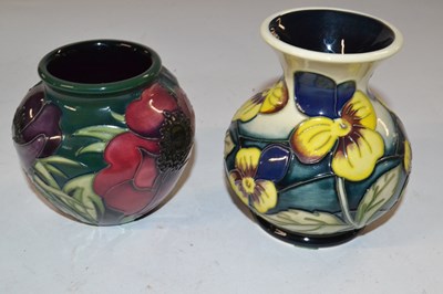 Lot 409 - A Moorcroft vase with tubelined floral design...