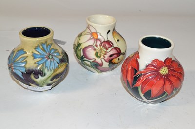 Lot 419 - Group of three small Moorcroft vases all with...