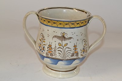 Lot 429 - A Leeds type pottery two handled loving cup,...