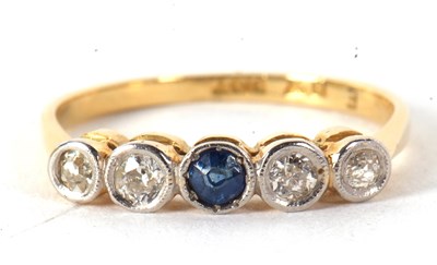 Lot 35 - A sapphire and diamond ring, set to centre...