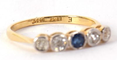 Lot 35 - A sapphire and diamond ring, set to centre...