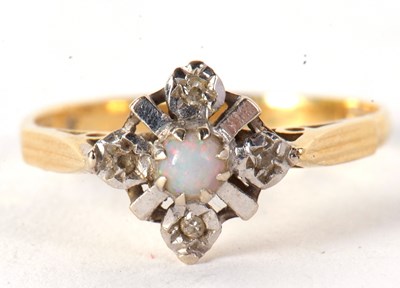 Lot 38 - An 18ct opal and diamond ring, the central...