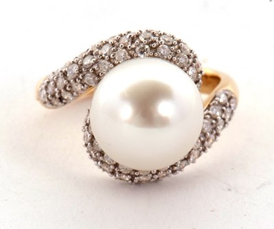 Lot 9 - An 18ct cultured pearl and diamond ring, the...