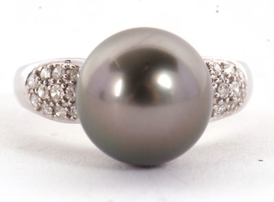 Lot 8 - An 18ct cultured black pearl and diamond ring,...