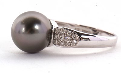 Lot 8 - An 18ct cultured black pearl and diamond ring,...