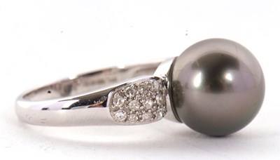 Lot 8 - An 18ct cultured black pearl and diamond ring,...