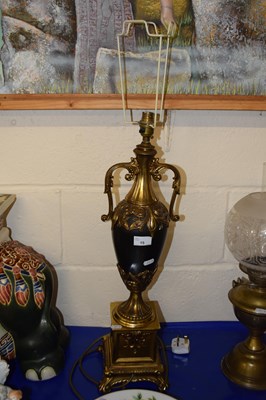 Lot 15 - A brass and composition table lamp with vase...