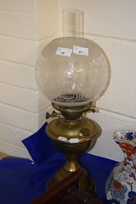 Lot 21 - Brass based oil lamp with frosted glass shade