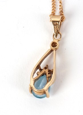 Lot 117 - A 9ct topaz pendant and chain, the pear shape...