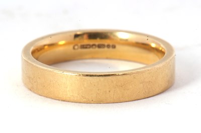 Lot 152 - An 18ct wedding band, 4mm wide, hallmarked...