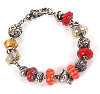 Lot 137 - A Troll Beads bracelet, the silver bracelet...