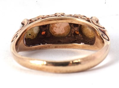 Lot 1 - A 9ct opal and garnet ring, the three slightly...