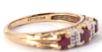 Lot 6 - A 9ct ruby and diamond ring, the three round...