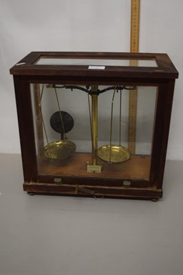 Lot 148 - Brass chemists beam scales in glazed cabinet
