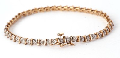 Lot 112 - A 9ct diamond bracelet, the small illusion set...