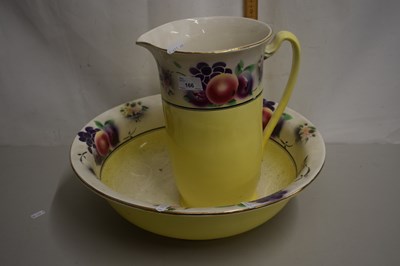 Lot 166 - Fruit decorated wash bowl and jug