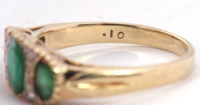 Lot 53 - A 9ct emerald and diamond ring, the three...