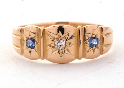 Lot 60 - An 18ct sapphire and diamond ring, the central...