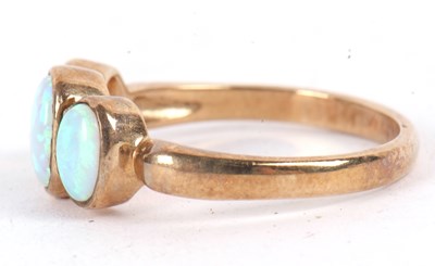 Lot 63 - A 9ct opal ring, the three oval opal cabochons...