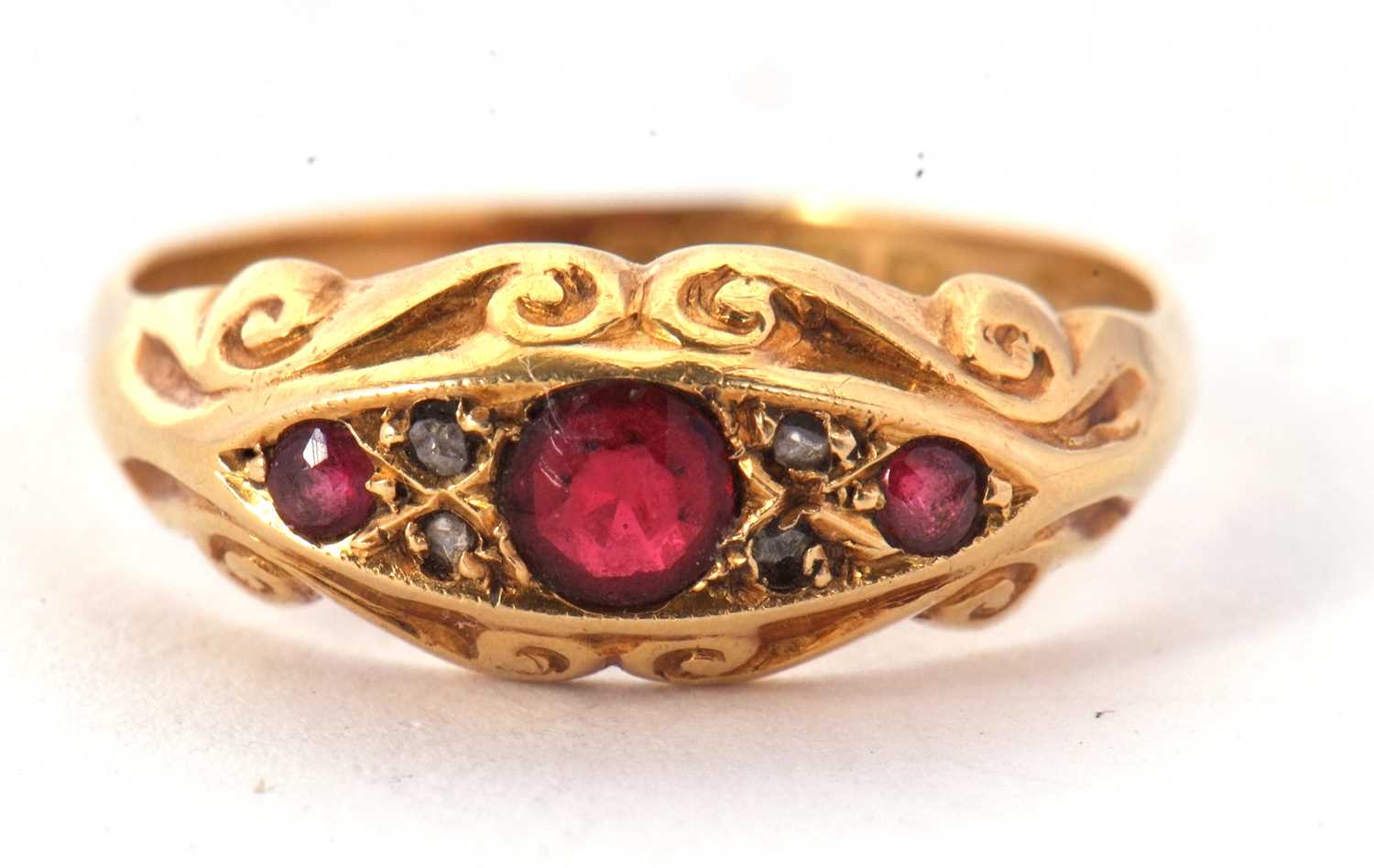 Lot 52 - An 18ct red stone and diamond ring, the three...