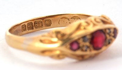 Lot 52 - An 18ct red stone and diamond ring, the three...