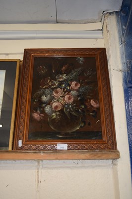 Lot 242 - Still life study of flowers set in a carved...