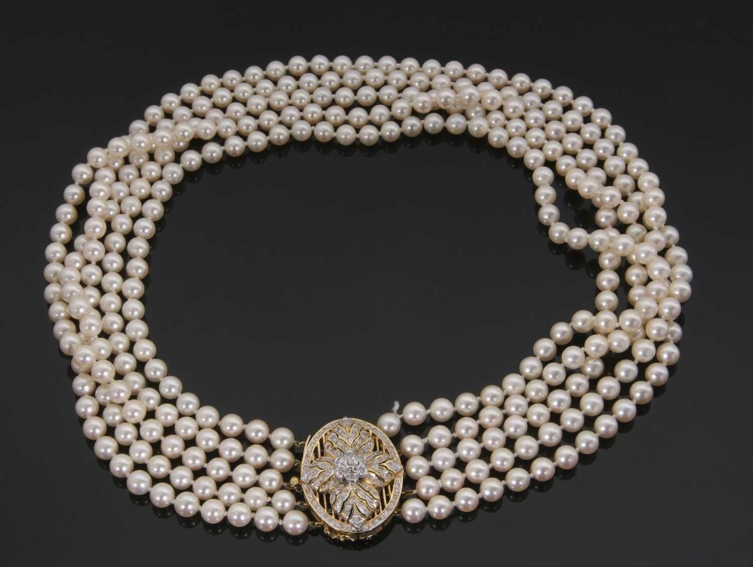 Lot 356 - A five strand cultured pearl necklace with an...