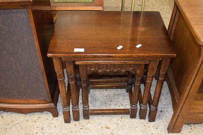 Lot 306 - A nest of three oak occasional tables