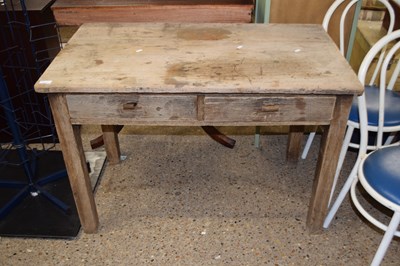 Lot 311 - Small weathered oak two drawer writing table