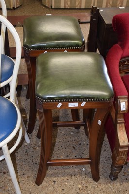 Lot 313 - A pair of leather upholstered stools