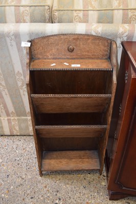 Lot 336 - A small early 20th Century oak magazine rack