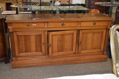 Lot 317 - A modern three door three drawer sideboard on...