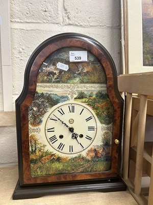 Lot 539 - A modern mantel clock decorated with country...