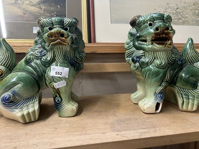 Lot 552 - A pair of Chinese foo dogs