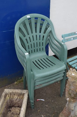 Lot 394 - Four green stacking plastic garden chairs