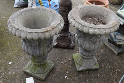 Lot 399 - Pair of concrete garden urns, 85cm high