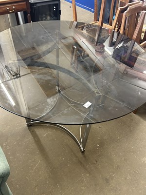 Lot 782 - A smoked glass top aluminium framed round...