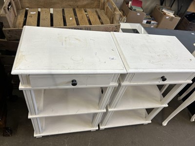 Lot 790 - A pair of three tier single drawer night stands