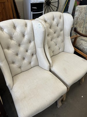 Lot 838 - A pair of cream upholstered button backed...