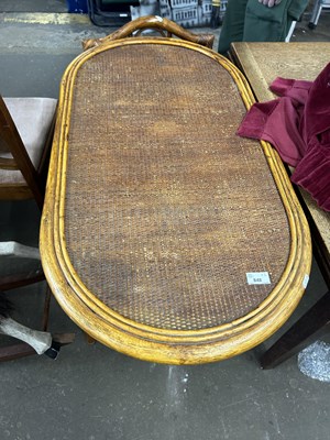 Lot 848 - An oval bamboo framed dining table and single...