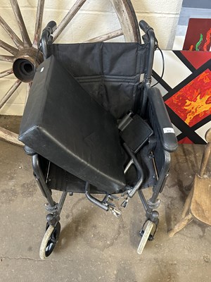 Lot 874 - A folding wheelchair