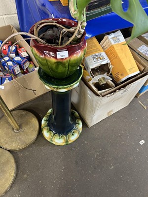 Lot 909 - A polychrome glazed jardiniere and stand