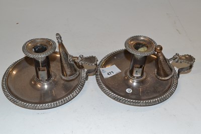 Lot 471 - Two candle holders with snuffers in silver plate