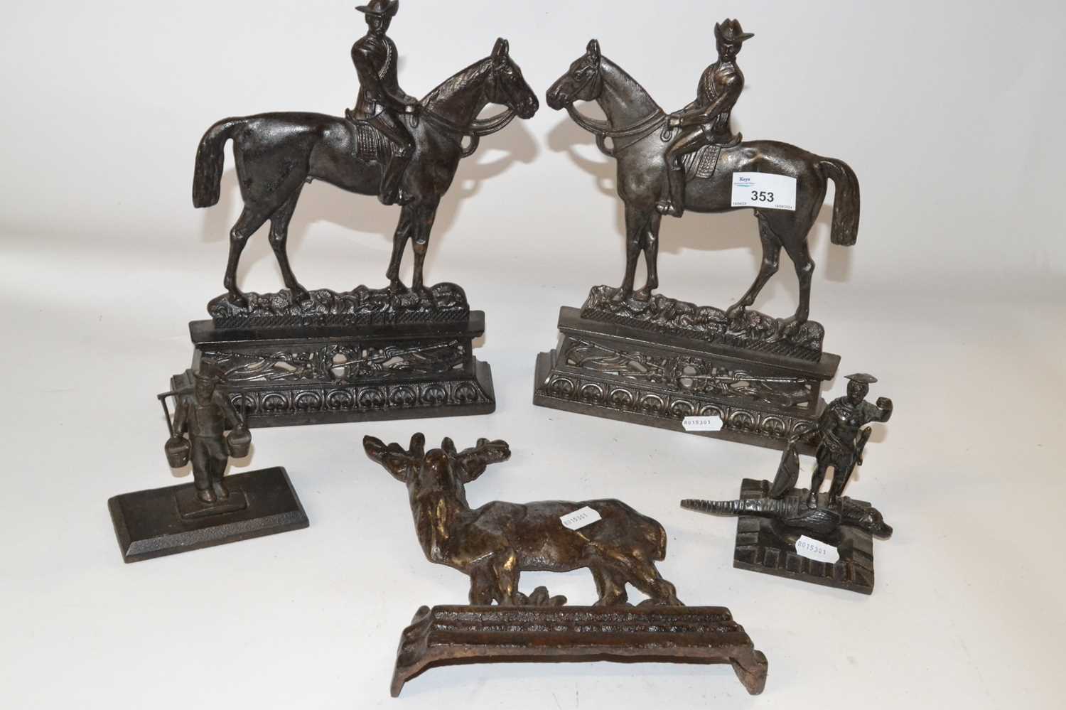 Lot 353 - A pair of cast iron door stops formed as...