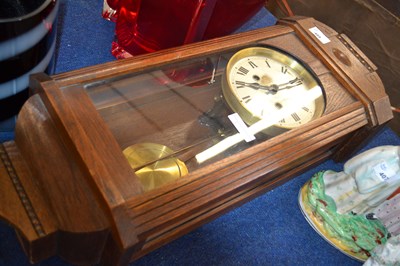 Lot 489 - A 20th Century oak cased wall clock with...