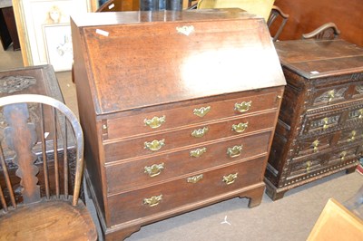 Lot 474 - A George III oak bureau of typical form with...