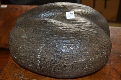 Lot 595 - A Coco de Mer in its natural unpolished state,...